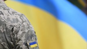 Ukraine Flag and Army Uniform